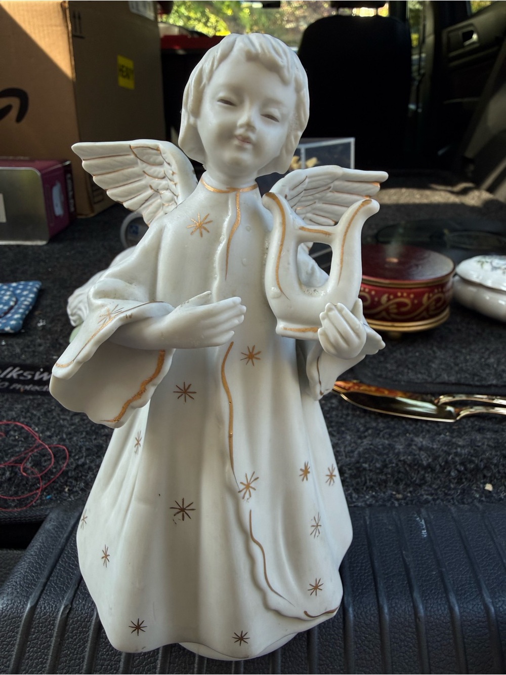 vintage white porcelain rotating angel music box with gold stars and gold accent